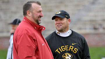 Arkansas Razorbacks head coach Bret Bielema talks with Missouri Tigers head coach Barry Odom 
