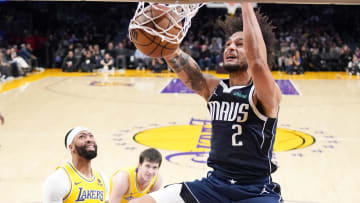 Jan 17, 2024; Los Angeles, California, USA; Dallas Mavericks center Dereck Lively II (2) dunks the ball against Los Angeles Lakers forward Anthony Davis (3) in the first half at Crypto.com Arena. Mandatory Credit: Kirby Lee-USA TODAY Sports