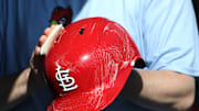Apr 9, 2025; Pittsburgh, Pennsylvania, USA;  The St. Louis Cardinals equipment manger scrubs the team batting helmets before the game against the Pittsburgh Pirates at PNC Park. Mandatory Credit: Charles LeClaire-Imagn Images