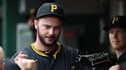 Jun 8, 2025; Pittsburgh, Pennsylvania, USA; Pittsburgh Pirates starting pitcher Paul Skenes (30) celebrates in the dugout after pitching 7 2/3 innings without surrendering an earned run against the Philadelphia Phillies during the eighth inning at PNC Park. Mandatory Credit: Charles LeClaire-Imagn Images