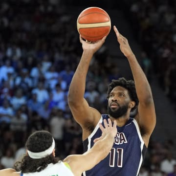 Aug 6, 2024; Paris, France; United States centre Joel Embiid (11) shoots against Brazil small forward Leo Meindl (14) in the first quarter in a men’s basketball quarterfinal game during the Paris 2024 Olympic Summer Games at Accor Arena. Mandatory Credit: Kyle Terada-USA TODAY Sports