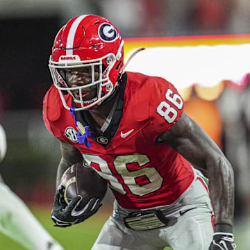 Oct 12, 2024; Athens, Georgia, USA; Georgia Bulldogs wide receiver Dillon Bell (86) runs after a catch against Mississippi State Bulldogs cornerback Kelley Jones (1) during the second half at Sanford Stadium. Mandatory Credit: Dale Zanine-Imagn Images