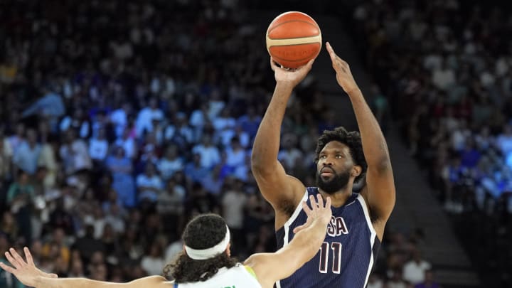 Aug 6, 2024; Paris, France; United States centre Joel Embiid (11) shoots against Brazil small forward Leo Meindl (14) in the first quarter in a men’s basketball quarterfinal game during the Paris 2024 Olympic Summer Games at Accor Arena. Mandatory Credit: Kyle Terada-USA TODAY Sports