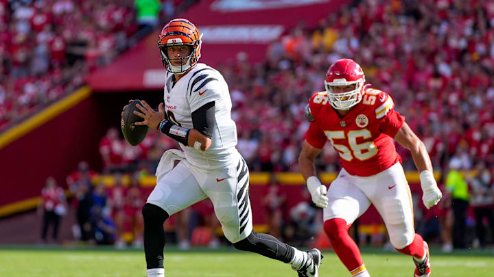 Cincinnati Bengals quarterback Joe Burrow (9) scrambles away from Kansas City Chiefs defensive end George Karlaftis (56) in the second quarter of the NFL Week 2 game between the Kansas City Chiefs and the Cincinnati Bengals at Arrowhead Stadium in Kansas City on Sunday, Sept. 15, 2024. The Bengals led 16-10 at halftime.