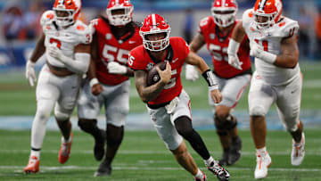 Georgia quarterback Carson Beck (15) runs the ball during the second half of the NCAA Aflac Kickoff Game against Clemson in Atlanta, on Saturday, Aug. 31, 2024.