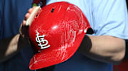 Apr 9, 2025; Pittsburgh, Pennsylvania, USA;  The St. Louis Cardinals equipment manger scrubs the team batting helmets before the game against the Pittsburgh Pirates at PNC Park. Mandatory Credit: Charles LeClaire-Imagn Images