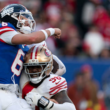 New York Giants quarterback Jaxson Dart takes a hit from the 49ers in last week's game.