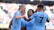 Erling Haaland (left) celebrates Manchester City's fourth goal in a thrashing against Southampton