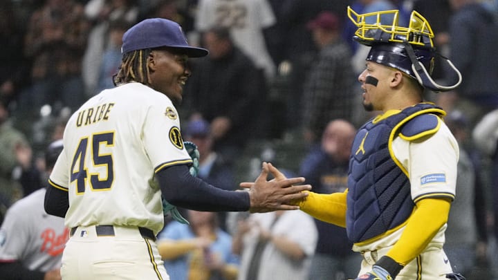 May 20, 2025; Milwaukee, Wisconsin, USA; Milwaukee Brewers pitcher Abner Uribe (45) and catcher William Contreras (24) celebrate a 5-2 win over the Baltimore Orioles at American Family Field. Mandatory Credit: Michael McLoone-Imagn Images