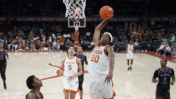 Texas guard Tre Johnson dunks during the second half against Delaware State. 