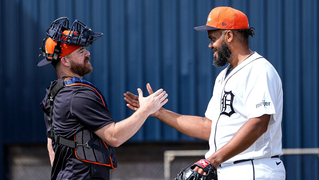 Detroit Tigers catcher Jake Rogers shakes hands with pitcher Kenley Jansen.