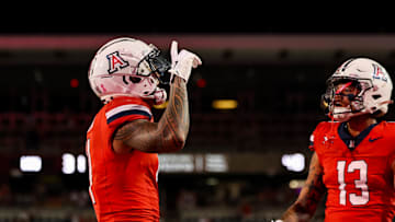 Oct 26, 2024; Tucson, Arizona, USA; Arizona Wildcats wide receiver Tetairoa McMillan (4) celebrates touchdown during the fourth quarter against the West Virginia Mountaineers at Arizona Stadium. Mandatory Credit: Aryanna Frank-Imagn Images