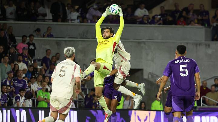 Mar 22, 2025; Orlando, Florida, USA; Orlando City goalkeeper Javier Otero (12) controls the ball against D.C. United in the second half at Inter&;Co Stadium. Mandatory Credit: Nathan Ray Seebeck-Imagn Images