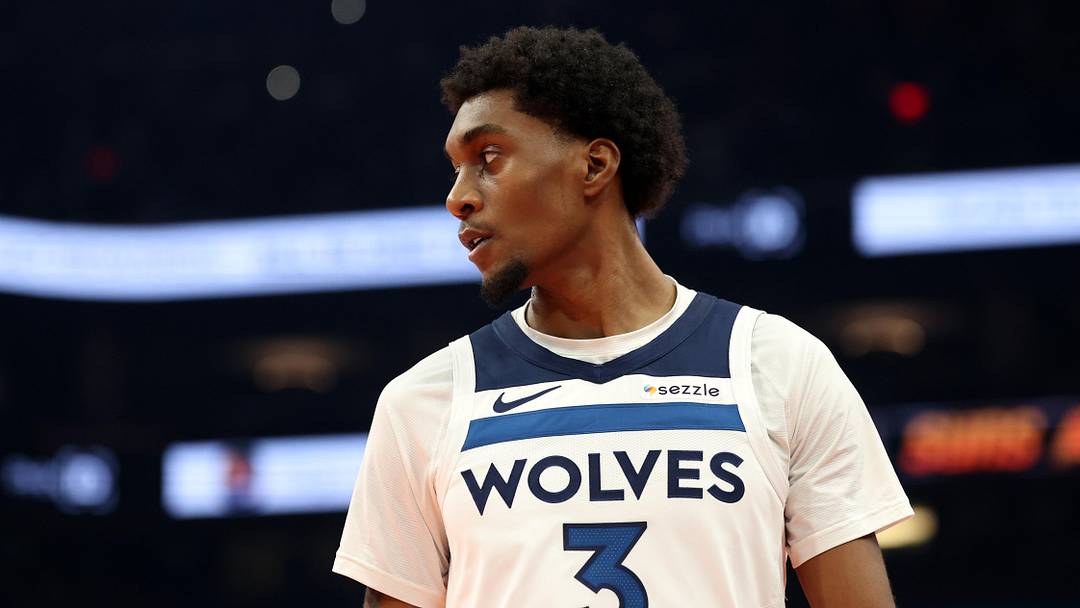 Nov 21, 2025; Phoenix, Arizona, USA; Minnesota Timberwolves forward Jaden McDaniels (3) against the Phoenix Suns during an NBA Cup game at Mortgage Matchup Center. Mandatory Credit: Mark J. Rebilas-Imagn Images