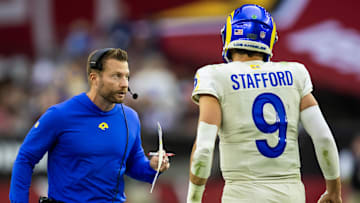 Nov 26, 2023; Glendale, Arizona, USA; Los Angeles Rams head coach Sean McVay talks with quarterback Matthew Stafford (9) against the Arizona Cardinals at State Farm Stadium. Mandatory Credit: Mark J. Rebilas-Imagn Images