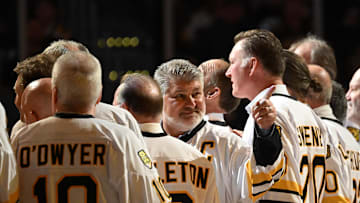 Jan 20, 2024; Boston, Massachusetts, USA; Former Boston Bruins Ray Bourque points to crowd during a ceremony before a game against the Montreal Canadiens at the TD Garden. Mandatory Credit: Brian Fluharty-Imagn Images