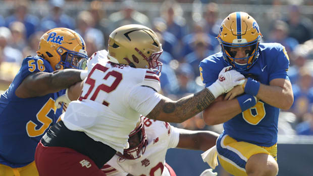 Pittsburgh Panthers quarterback Mason Heintschel (6) runs the ball against Boston College Eagles