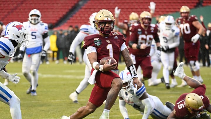 Dec 28, 2023; Boston, MA, USA; Boston College Eagles quarterback Thomas Castellanos (1) runs in for a touchdown during the second half against the Southern Methodist Mustangs at Fenway Park. Mandatory Credit: Eric Canha-USA TODAY Sports