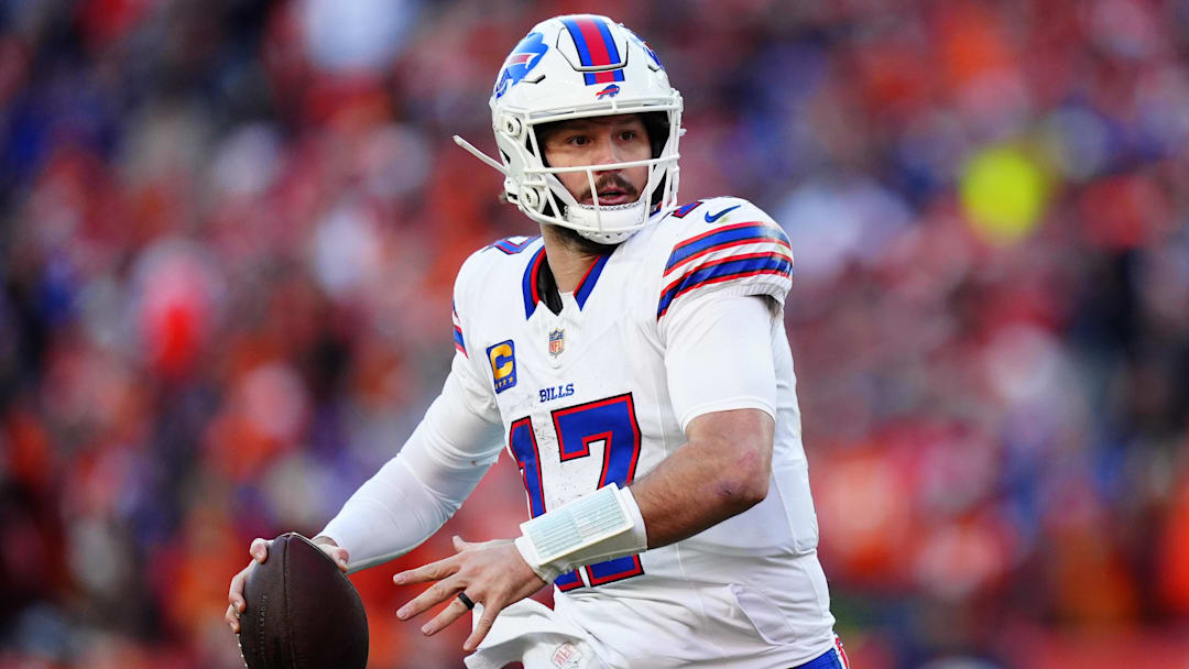 Buffalo Bills quarterback Josh Allen (17) rolls out during the second quarter of an AFC Divisional Round playoff game against the Denver Broncos at Empower Field at Mile High. 