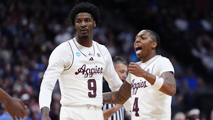Texas A&M Aggies guard Wade Taylor IV (4) reacts with teammates against the Michigan Wolverines during the first half in the second round of the NCAA Tournament at Ball Arena. Texas A&M Aggies guard Wade Taylor IV (4) reacts with teammates against the Michigan Wolverines during the first half in the second round of the NCAA Tournament at Ball Arena.