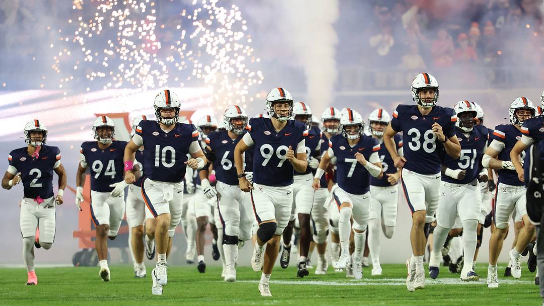 Oct 10, 2026; Charlottesville, Virginia, USA; Virginia Cavaliers players take to the field prior to their game against the Syracuse Orange at Scott Stadium. Mandatory Credit: Geoff Burke-Imagn Images