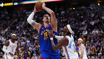 May 9, 2025; Denver, Colorado, USA; Oklahoma City Thunder guard Shai Gilgeous-Alexander (2) defends on Denver Nuggets center Nikola Jokic (15) in the second half during game three of the second round for the 2025 NBA Playoffs at Ball Arena. Mandatory Credit: Ron Chenoy-Imagn Images