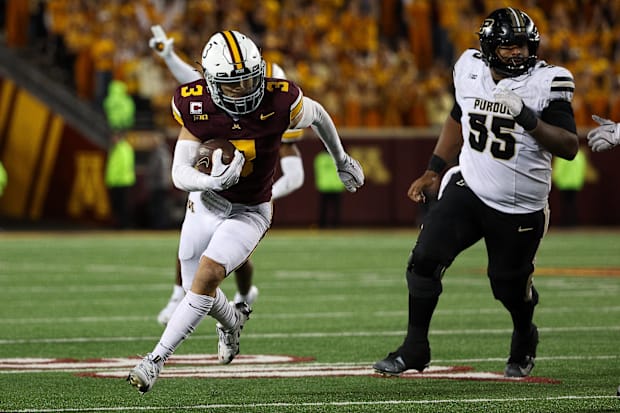 Minnesota Golden Gophers defensive back Koi Perich (3) intercepts a pass for a touchdown against the Purdue Boilermakers