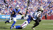 Sep 28, 2025; Orchard Park, New York, USA; New Orleans Saints running back Alvin Kamara (41) is tackled by Buffalo Bills cornerback Tre'Davious White (27) during the fourth quarter at Highmark Stadium. Mandatory Credit: Gregory Fisher-Imagn Images