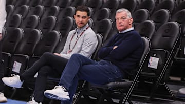 Atlanta Hawks owner Tony Ressler and son Nick Ressler talk before a game against the Chicago Bulls