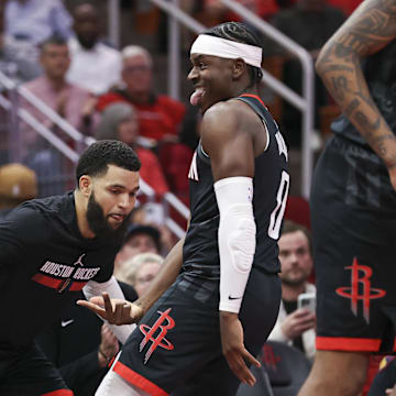 Nov 15, 2024; Houston, Texas, USA; Houston Rockets guard Aaron Holiday (0) reacts with guard Fred VanVleet (5) after making a basket during the fourth quarter against the Los Angeles Clippers at Toyota Center. Mandatory Credit: Troy Taormina-Imagn Images