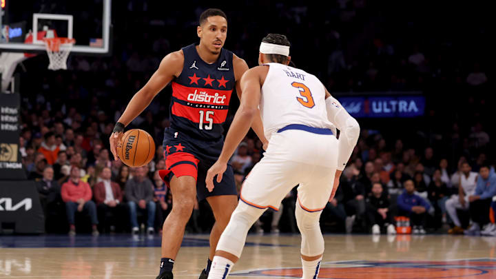 Nov 18, 2024; New York, New York, USA; Washington Wizards guard Malcolm Brogdon (15) controls the ball against New York Knicks guard Josh Hart (3) during the first quarter at Madison Square Garden. Mandatory Credit: Brad Penner-Imagn Images