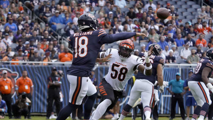 Aug 17, 2024; Chicago, Illinois, USA; Cincinnati Bengals defensive end Joseph Ossai (58) defends Chicago Bears quarterback Caleb Williams (18) during the first half at Soldier Field. Mandatory Credit: David Banks-USA TODAY Sports