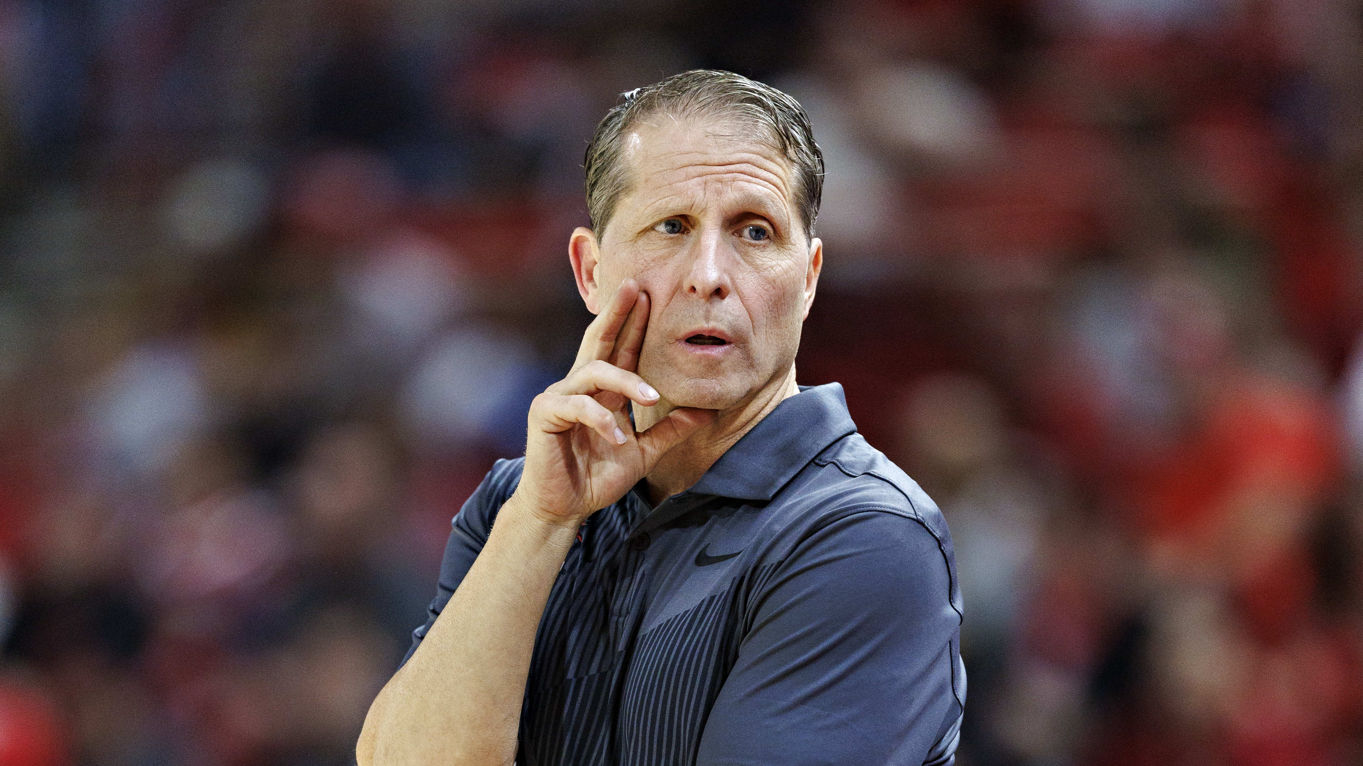 Arkansas coach Eric Musselman looks to his bench during a game against Georgia.