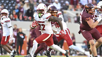 Nov 1, 2025; Blacksburg, Virginia, USA; Louisville Cardinals running back Keyjuan Brown (22) runs the ball for a touchdown against the Virginia Tech Hokies during the fourth quarter at Lane Stadium. Mandatory Credit: Brian Bishop-Imagn Images
