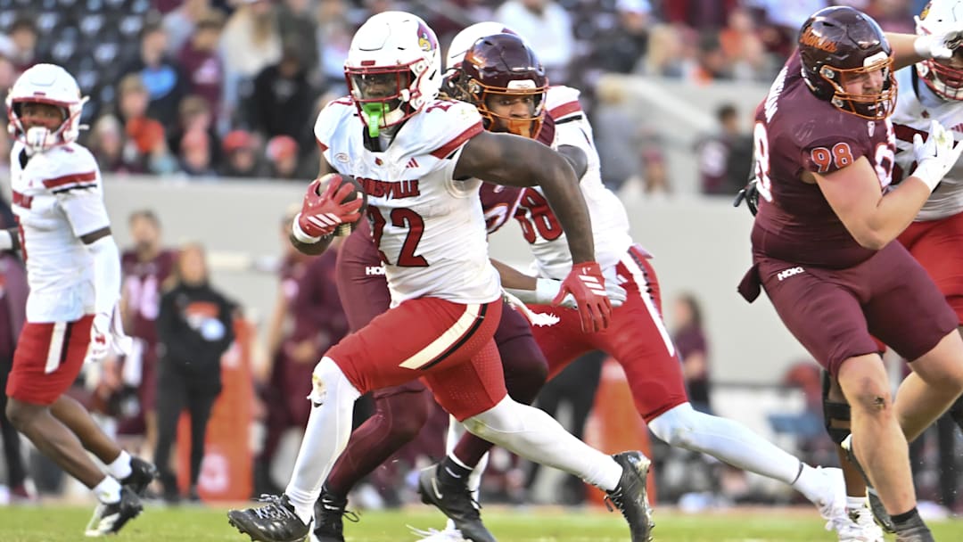 Nov 1, 2025; Blacksburg, Virginia, USA; Louisville Cardinals running back Keyjuan Brown (22) runs the ball for a touchdown against the Virginia Tech Hokies during the fourth quarter at Lane Stadium. Mandatory Credit: Brian Bishop-Imagn Images