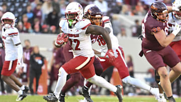 Nov 1, 2025; Blacksburg, Virginia, USA; Louisville Cardinals running back Keyjuan Brown (22) runs the ball for a touchdown against the Virginia Tech Hokies during the fourth quarter at Lane Stadium. Mandatory Credit: Brian Bishop-Imagn Images