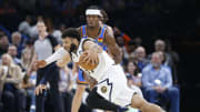 Nov 3, 2022; Oklahoma City, Oklahoma, USA; Oklahoma City Thunder guard Shai Gilgeous-Alexander (2) defends Denver Nuggets guard Jamal Murray (27) on a drive to the basket during the second half at Paycom Center. Denver won 122-110. Mandatory Credit: Alonzo Adams-USA TODAY Sports