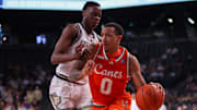 Mar 4, 2025; Atlanta, Georgia, USA; Miami Hurricanes guard Matthew Cleveland (0) is defended by Georgia Tech Yellow Jackets forward Darrion Sutton (10) in the first half at McCamish Pavilion. Mandatory Credit: Brett Davis-Imagn Images