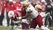 Dec 28, 2024; Bronx, NY, USA; Nebraska Cornhuskers tight end Luke Lindenmeyer (44) is tackled by Boston College Eagles linebacker Bryce Steele (2) during the first half at Yankee Stadium. Mandatory Credit: Vincent Carchietta-Imagn Images