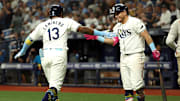 Tampa Bay Rays third baseman Junior Caminero (13) is congratulated by first base Jonathan Aranda after hitting a home run. 