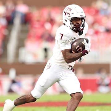 Oct 18, 2025; Fayetteville, Arkansas, USA; Texas A&M Aggies wide receiver KC Concepcion (7) runs after a catch during the first quarter against the Arkansas Razorbacks at Donald W. Reynolds Razorback Stadium. Mandatory Credit: Nelson Chenault-Imagn Images