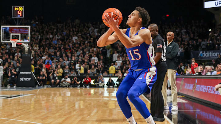 Jan 10, 2024; Orlando, Florida, USA; Kansas Jayhawks guard Kevin McCullar Jr. (15) shoots a three