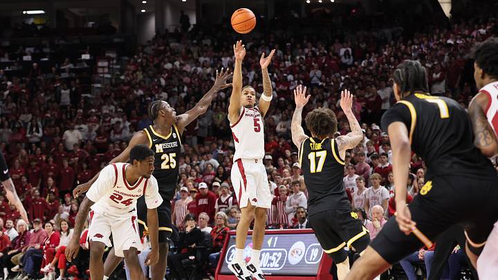 Feb 21, 2026; Fayetteville, Arkansas, USA; Arkansas Razorbacks guard Darius Acuff Jr (5) shoots during the first half against the Missouri Tigers at Bud Walton Arena. Mandatory Credit: Nelson Chenault-Imagn Images