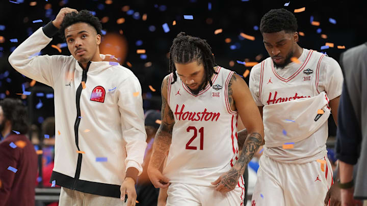 Apr 7, 2025; San Antonio, TX, USA; Houston Cougars guard Emanuel Sharp (21) and teammates walk off the court after losing to the Florida Gators in the national championship game of the Final Four of the 2025 NCAA Tournament at the Alamodome. Mandatory Credit: Robert Deutsch-Imagn Images