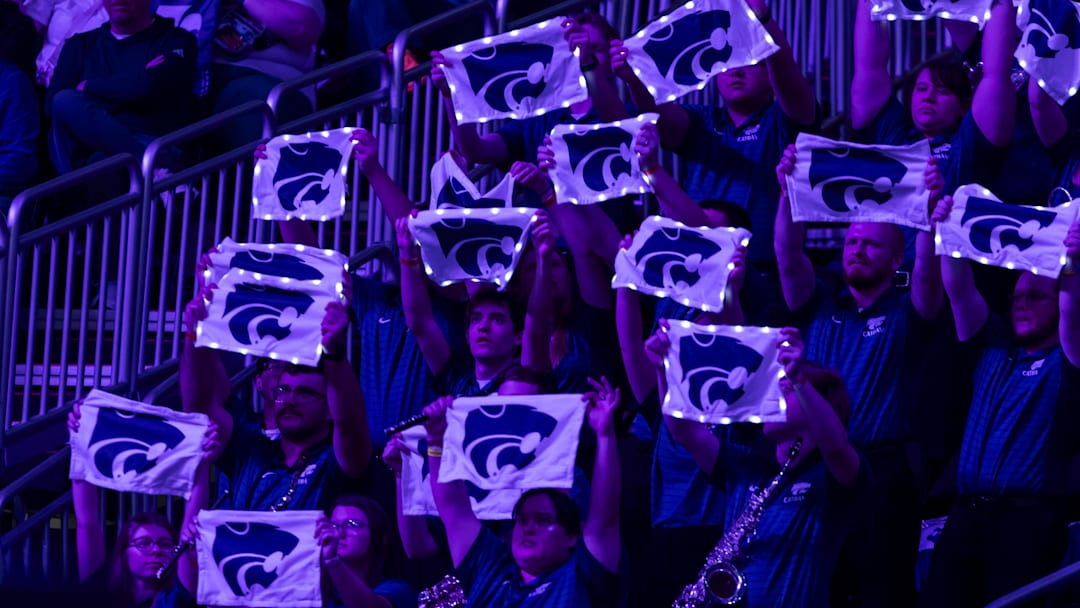 Mar 7, 2026; Kansas City, MO, USA;  Members of the Kansas State Wildcats hold lighted towels during the first half against the TCU Horned Frogs at T-Mobile Center. Mandatory Credit: Nick Tre. Smith-Imagn Images