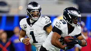 Philadelphia Eagles quarterback Jalen Hurts (L) and running back Saquon Barkley (R)