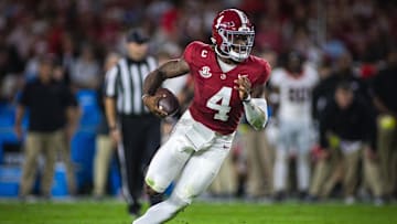Sep 28, 2024; Tuscaloosa, Alabama, USA;  Alabama Crimson Tide quarterback Jalen Milroe (4) runs against the Georgia Bulldogs during the first quarter at Bryant-Denny Stadium. Mandatory Credit: Will McLelland-Imagn Images