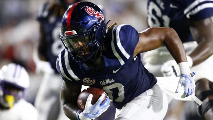 Aug 31, 2024; Oxford, Mississippi, USA; Mississippi Rebels running back Matt Jones (0) runs the ball for a touchdown during the second half  against the Furman Paladins at Vaught-Hemingway Stadium. Mandatory Credit: Petre Thomas-USA TODAY Sports