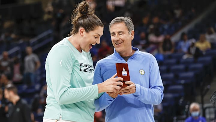 Jul 29, 2022; Chicago, Illinois, USA; New York Liberty center Stefanie Dolson (L) reacts as she receives 2021 WNBA Championship Ring from Chicago Sky owner Michael Alter (R) before the WNBA game between the Chicago Sky and New York Liberty at Wintrust Arena. Mandatory Credit: Kamil Krzaczynski-Imagn Images