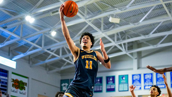 Wheeler Wildcats forward Amare James (11) goes for a lay up during the fourth quarter of a City of Palms Classic quarterfinal game against the Principia Panthers at Suncoast Credit Union Arena in Fort Myers, Fla., on Saturday, Dec. 20, 2025.